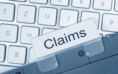 Claims button on computer. Learn how to file a slip and fall claim against Walmart and how a lawyer can help.