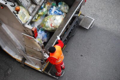 Garbage truck driving on highway