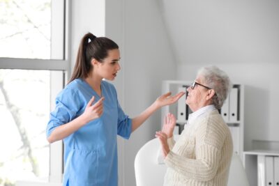 Medical worker mistreating senior woman