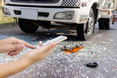 A woman calling for help after a truck accident