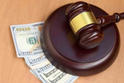 Gavel under money