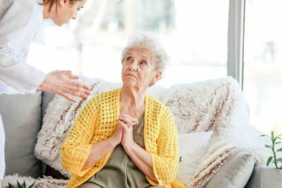 Nurse yelling at an old woman