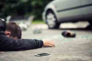 Pedestrian lying on the street after an accident