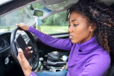 Woman texts while driving