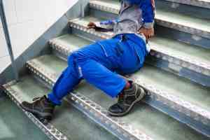 Worker lying on the stairs