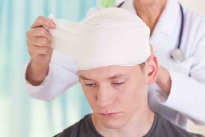 Young man bandaged head