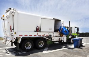 Garbage truck collecting trash