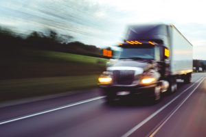 Truck driving fast on the road