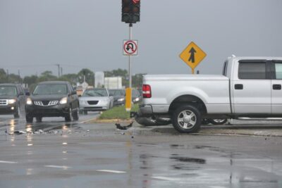 Intersection car accident with red traffic light