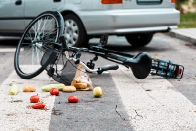 Bike lying in street after being struck by car