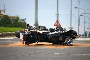 Fallen motorcycle on street