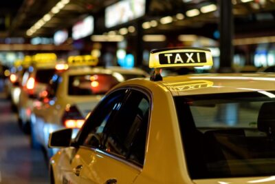 Fleet of taxis parked in line