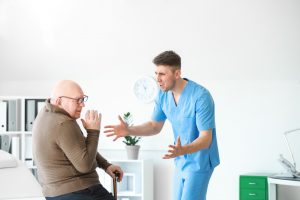 Nurse yells at frightened old man