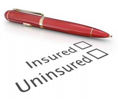 Pen and paper with blank insured and uninsured check boxes