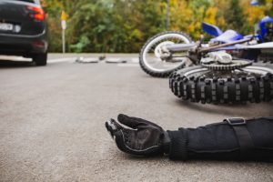 Rider thrown off bike after collision