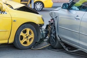 Yellow taxi crashed into car