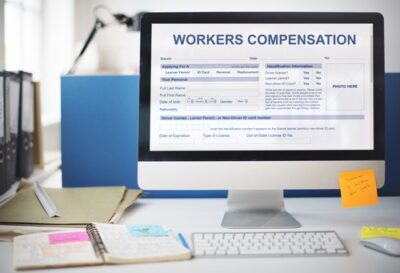 A computer screen with information about workers’ comp. A lawyer can explain how workers’ compensation payments work in Georiga.