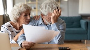 Elderly couple struggles with paperwork