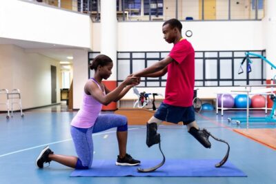 Man with prosthetics doing physiotherapy