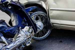 Motorcycle tire crashed into a car tire