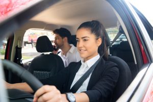 Rideshare driver with passenger in back seat