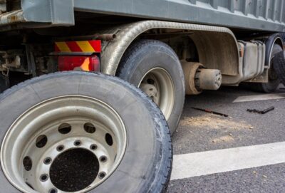 Tractor trailer with a fallen wheel