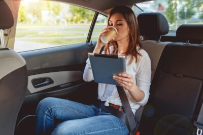 Woman in back seat of rideshare