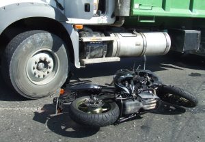 Black motorcycle on asphalt after road accident