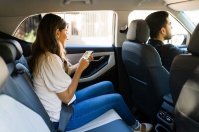 Female passenger in a lyft car