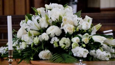 Funeral flower spray on a coffin