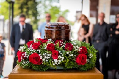 Funerary urn with flowers at a funeral