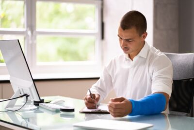 Injured man filling out a claim form