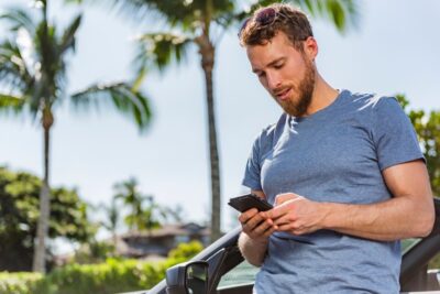 Man ordering rideshare service