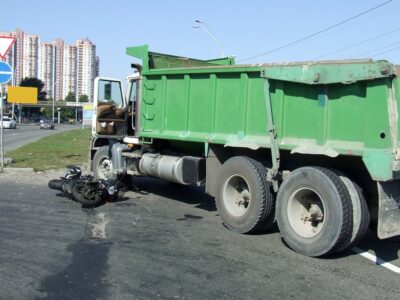 Motorcycle accident with garbage truck