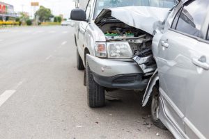 Silver car crashed into the back of another