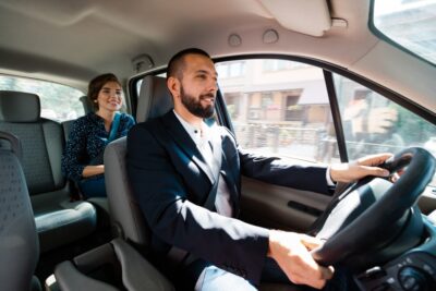 Uber driver driving passenger