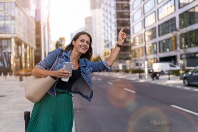 Woman hailing a rideshare car