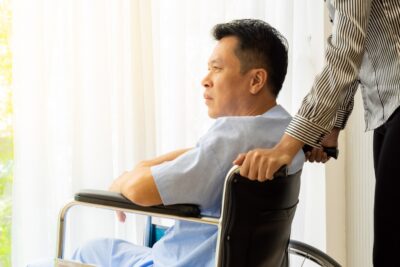 Man in wheelchair in hospital room