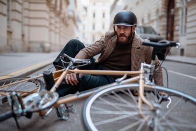 Man on ground with a bike