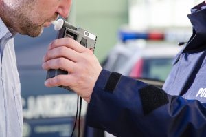 Man taking a breathalyzer