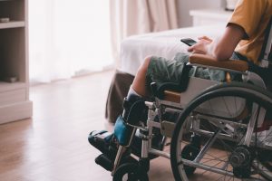 Asian child in wheelchair