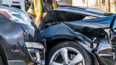 Close up on smashed black cars