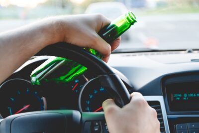 Driver with a beer bottle