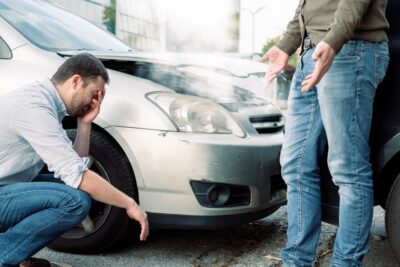 Men arguing after a car accident