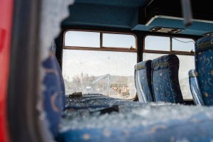 Seats broken windows wrecked bus