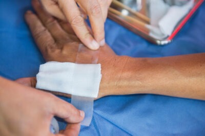 Man with a gauze bandage on his hand