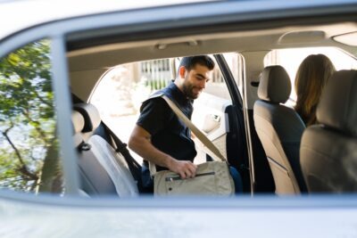 Man getting into a rideshare van scaled