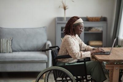 Woman in wheelchair working scaled