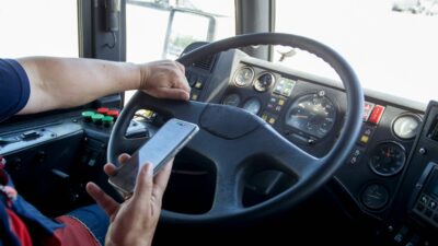 Bus driver texting at the wheel