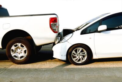 Compact car rear ending truck